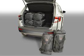 The ice drives the front wheels permanently, and the rear wheels are driven through an electrically or mechanically operated clutch if necessary. Skoda Karoq Travel Bags Car Bags Com