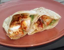 Onions are cooked until soft, with garlic, ginger and chillies, dolloped with mustard, and with crisp edged fish fingers mashed into the pan at the end, with coriander, spinach and lime. Hake