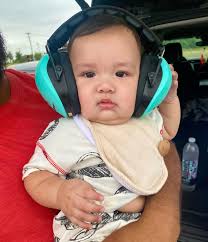 Mi amor enjoying his first trip to the beach con sus primitos 🌊🏖️☀️