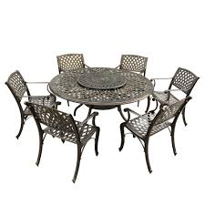 The area has a round dining table made out of wrought iron with a set of. Unbranded Contemporary Modern 7 Piece Bronze Aluminum Outdoor Dining Set With Lazy Susan And 6 Chairs Hd1022 1016 6 Bz The Home Depot