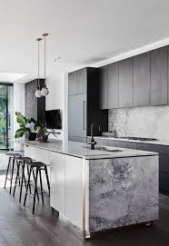 A modern country kitchen with light grey cabinets, butcherblock, white countertops, black fixtures and a vintage metal lamp. Kitchen Island Designs That Are Both Perfect And Practical