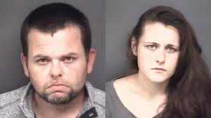 Two arrested in stolen moving truck, stolen gun found inside