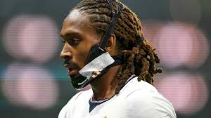 Why does Djed Spence wear a jaw brace when playing for England?