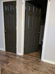 For the island, there are some dark accents in your tile above the stove so a contrasting option could be a charcoal/brown such as urbane bronze by sherwin williams. Sherwin Williams Urbane Bronze Doors With Olympus White Walls Urbane Bronze Doors Sherwin Williams Urbane Bronze Door Urbane Bronze