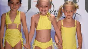 Ikks uses a surfboard to sign its new swimwear line. Child Models In Bikinis Spark Controversy At Fashion Show