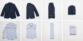 A Step By Step Guide To Packing Your Dress Clothes In A Suitcase Fold Suit Jacket Suit Shirts Suitcase Packing