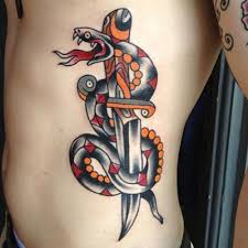 The two figures, snakes and knives, show the pagan symbol of fertility and rebirth and surgical tool. Traditional Snake And Dagger Tattoo Flash Tattoo Designs Ideas