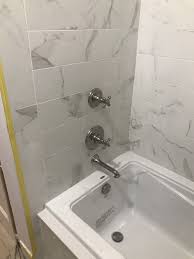 While a granite floor does stand out, the rest of the bathroom design plays an important role in enhancing the collective look. Kennedy Tile Marble Custom White Bathroom Granite Counters And Shower Tiles Paramus Nj