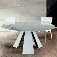As a general rule, extending dining tables fall into two camps: Barcelona Cortina White Marble Round Dining Table Robson Furniture