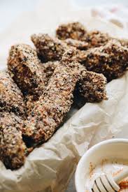 In a shallow bowl combine the ingredients for the breading which includes panko breadcrumbs, parmesan cheese, garlic powder, thyme, parsley, paprika, salt and pepper. Everything Bagel Baked Chicken Tenders The Healthy Maven