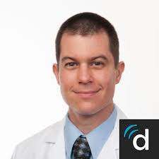 Dr. Justin K. Scheer, MD