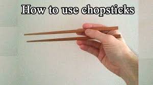 Rest the first chopstick on the base of your thumb while holding it between your middle and. How To Use Chopsticks Short And Easy Tutorial Youtube
