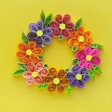 Take another strip of blue quilling paper and use it to wrap around the pattern. Paper Quilling Wreath With Easy Quilled Paper Flowers