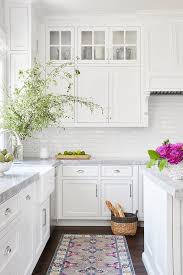 Kitchen cabinets that suit you and how you use your kitchen will save time and effort every time you cook (or empty the dishwasher). White Beveled Subway Tiles With Gray Marble Countertops Transitional Kitchen