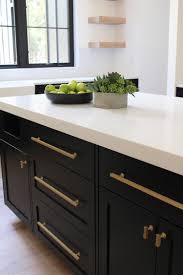 Modern design trends generally point to all white as the kitchen color palette of choice. Modern White Kitchen Cabinets Black Hardware Novocom Top