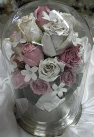 Wedding bouquet with red roses on the table. Many Table Top Containers To Display Your Preserved Wedding Flowers