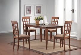 The Logan 5 Piece Wheat Back Dining Room Set Offers A Elegant And Comfortable Dining Experienc Dining Furniture Walnut Finish Dining Table Walnut Dining Table