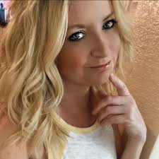 Why is my 1.5-year-old lab still peeing in her crate and how can I address  this issue?