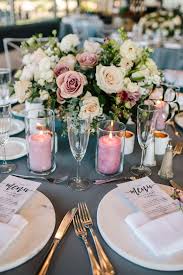 Marble Chargers With Mauve Candles And Mauve Florals Florals By Layers Of Lovely Coordination By W Wedding Floral Centerpieces Low Centerpieces Mauve Wedding