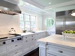 I do not think it is a good idea for numerous reasons but does the code allow for it? Windows Over Stove Design Ideas