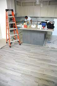Neutral greys such as gravel roads are a good fit for modern design schemes as well. Porcelain Tile In The Gravel Road Color From The Saddlebrook Collection Of Daltile On The Floors Of Jennifer H Flooring Farmhouse Chic Kitchen Wood Tile Floors