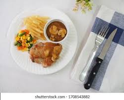 Steak diane medallions of steak covered with black peppercorns and a rich mushroom wine sauce. Steak Ayam Chicken Steak Served French Stock Photo Edit Now 1708543882