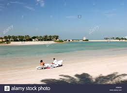 The kingdom of bahrain is an island nation in the arabian gulf, situated between the east coast of saudi arabia and the qatar peninsula. The Ritz Carlton Bahrain Hotel Spa Manama Bahrain Arabischen Halbinsel Tourismus Pool Park Strand Meer Ubersicht Aus Einer Stockfotografie Alamy