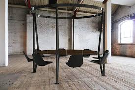 A Modern King Arthur Table With Swinging Chairs Looks To Make Boring Meetings Much More Fun Table Swing Yankodesign Swing Table King Arthur Furniture