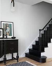 Before After A Circa 1850s Row House In Jersey City Gets A Fresh Modern Makeover By Mowery Marsh Architects Black Staircase Black Stair Railing Staircase Design