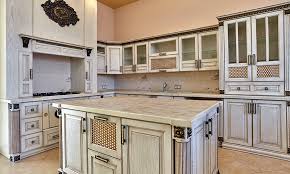 Black distressed cabinets, a few lightened with custom leaded glass panels, provide a gorgeous backdrop for this traditional kitchen. Different Types Of Kitchen Cabinet Doors For Your Home Design Cafe