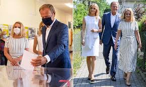 Donald tusk has sparked outrage on social media for uploading a picture of himself making a gun gesture with his hand behind us president fury as tusk makes shooting gesture behind trump. Donald Tusk Dons A Facemask As He Heads To The Polls For Poland S Presidential Election Daily Mail Online