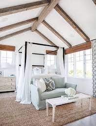 Plus, wood beams that span the ceiling can further increase its visual appeal, and they provide a place from which to mount light fixtures. Pin By Ashley Calvi On Coastal Living Nest Coastal Master Bedroom House Master Bedroom Beach House Interior
