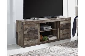 Signature design by ashley trinell tv stand, brown. Derekson 60 Tv Stand Ashley Furniture Homestore