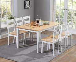 Including four slatted back chairs with slightly curved angles throughout, in a bright colored finish. Mark Harris Chichester Oak And White Large Dining Table And 6 Chairs Cfs Furniture Uk