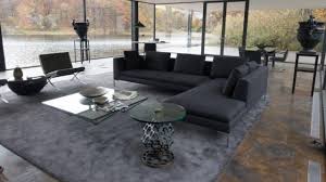 Its steel base is outfitted in a textured gunmetal finish and boasts an open picket shelf. The Coffee Table Paolo Piva At Bruce Wayne Ben Affleck In The Batman V Superman Dawn Of Justice Spotern
