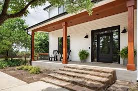 The crossover between a porch and a balcony just screams modern style. Check Out This Modern Farmhouse Style Front Porch With Natural Stone Steps On Hgtv Com Modern Farmhouse Exterior Modern Farmhouse Porch Modern Front Porches