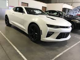 White walls, stainless steel appliances, and lots of natural light brighten up this kitchen with black cabinets. 2018 Camaro Ss Vinyl Wrap Camaro6