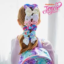 A large jojo siwa pastel rainbow signature hair bow is attached to a salon alligator hair clip and hair tie, pastel purple faux pony tail swirls down from the bow. Jojo Siwa Mini Hair Bows 7 Pack Mini Hair Bows Jojo Siwa Bows Jojo