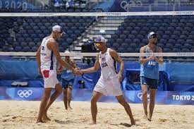 From partial isolation, U.S. beach volleyball team moves on | AP News