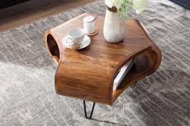 Or, you can choose a table that pops out with a bright colour or exciting design. Coffee Tables Buy Wooden Coffee Tables Online In Varying Designs And Size Saraf Furniture