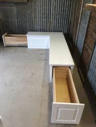 Many homeowners use the space underneath a banquette seat for storage, but when it's outside, using that space to stow outdoor cushions is particularly smart. Banquette Corner Bench Seat With Storage Drawers Raw Unfinished Kitchen Corner Bench Corner Bench Seating Storage Bench Seating