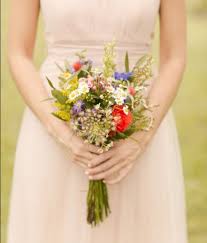 Many brides think that wildflower wedding bouquets are only for the boho brides, we disagree! Wildflower Bridal Bouquet Wildflower Bridal Bouquets Bridal Bouquet Styles Summer Camp Wedding