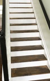 I feathered my brush towards the center, parallel to the wood grain. How To Stain Stairs