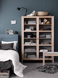 A sidebar in a living room is safeguarded by glass cabinet doors to ensure you find drinks on time. The Everygirl S 11 Favorite Pieces From Ikea How To Style Them