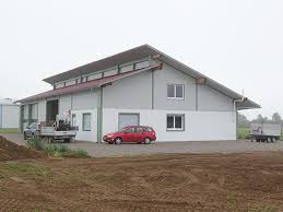 Alle notwendigen bauteile für ihre gedämmte halle liefern wir ihnen in erstklassiger qualität und milimetergenauer fertigung. Produktions Und Lagerhallen Dausch Hallen