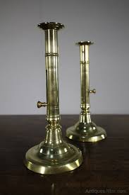 This cut out flame design is symbolic of the. Antiques Atlas Pair Of Georgian Antique Push Up Brass Candlestick