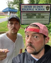I've been hiking the hills of my hometown Highlands to get in shooting  shape for #clerks3, and @jaymewes has started to join me. So here's  @jayandsilentbob outside of their high school, @hhrsnjhs.