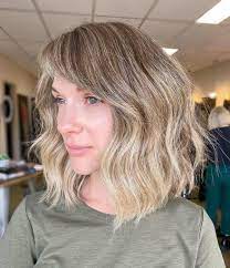 The hair is layered in order to give the hair more height and body, while the bangs have been left long in the front in order to give the style a little more edge. 21 Best Side Swept Bangs 2021 Ideas Pictures