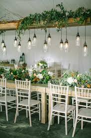 Wedding Greenery Decor With Hanging Lights The Bohemian Wedding Backyard Wedding Decorations Greenery Wedding Decor Rustic Wedding Table