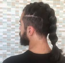 Back View Of A Man With Dark Long Hair In A Braided Ponytail With An Undercut Menshairstyles Undercut Long Hair Long Hair Styles Edgy Long Hair